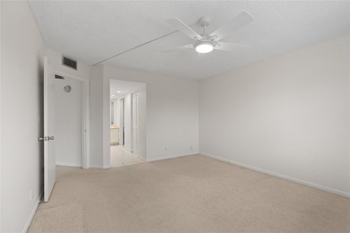 Experience the vibrant, active South Florida lifestyle in this on Wynmoor Golf Course in Florida - for sale on GolfHomes.com, golf home, golf lot