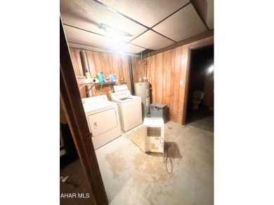 Located on a sprawling one-acre lot, this bi-level home offers on Iron Masters Country Club in Pennsylvania - for sale on GolfHomes.com, golf home, golf lot