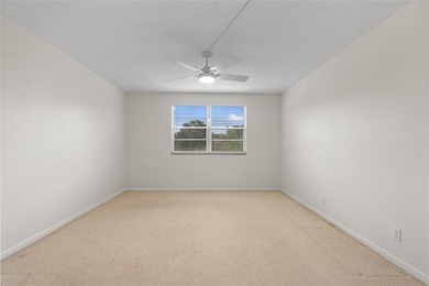 Experience the vibrant, active South Florida lifestyle in this on Wynmoor Golf Course in Florida - for sale on GolfHomes.com, golf home, golf lot