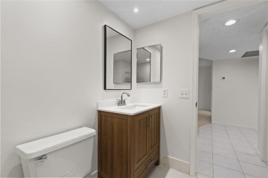 Experience the vibrant, active South Florida lifestyle in this on Wynmoor Golf Course in Florida - for sale on GolfHomes.com, golf home, golf lot