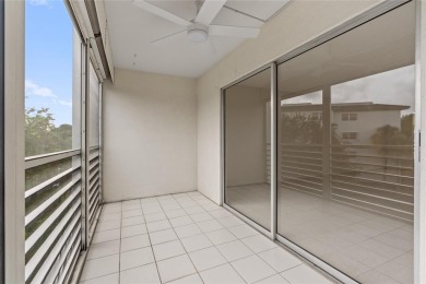 Experience the vibrant, active South Florida lifestyle in this on Wynmoor Golf Course in Florida - for sale on GolfHomes.com, golf home, golf lot