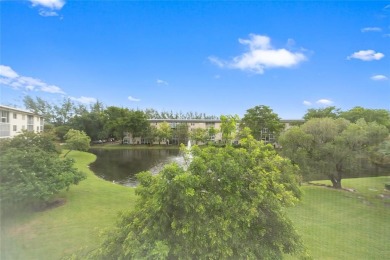 Experience the vibrant, active South Florida lifestyle in this on Wynmoor Golf Course in Florida - for sale on GolfHomes.com, golf home, golf lot
