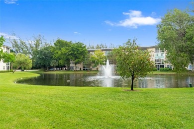Experience the vibrant, active South Florida lifestyle in this on Wynmoor Golf Course in Florida - for sale on GolfHomes.com, golf home, golf lot