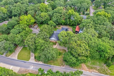 Experience resort-style living in this beautiful 4-bedroom on Hide-A-Way Lake Golf Course in Texas - for sale on GolfHomes.com, golf home, golf lot