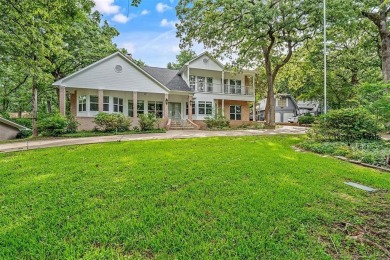 Experience resort-style living in this beautiful 4-bedroom on Hide-A-Way Lake Golf Course in Texas - for sale on GolfHomes.com, golf home, golf lot