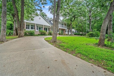 Experience resort-style living in this beautiful 4-bedroom on Hide-A-Way Lake Golf Course in Texas - for sale on GolfHomes.com, golf home, golf lot