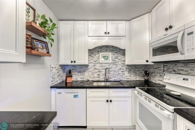 This charming, partially furnished, two bedroom, one and a half on Hillsboro Pines Golf in Florida - for sale on GolfHomes.com, golf home, golf lot