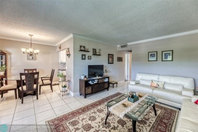This charming, partially furnished, two bedroom, one and a half on Hillsboro Pines Golf in Florida - for sale on GolfHomes.com, golf home, golf lot