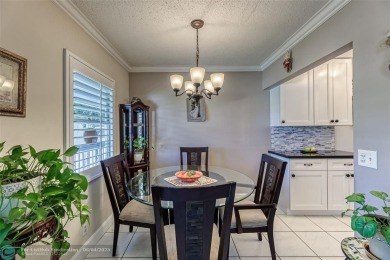 This charming, partially furnished, two bedroom, one and a half on Hillsboro Pines Golf in Florida - for sale on GolfHomes.com, golf home, golf lot