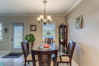 This charming, partially furnished, two bedroom, one and a half on Hillsboro Pines Golf in Florida - for sale on GolfHomes.com, golf home, golf lot