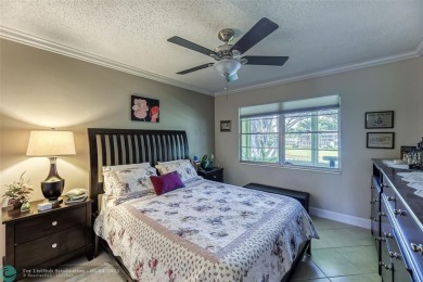 This charming, partially furnished, two bedroom, one and a half on Hillsboro Pines Golf in Florida - for sale on GolfHomes.com, golf home, golf lot