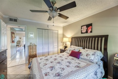 This charming, partially furnished, two bedroom, one and a half on Hillsboro Pines Golf in Florida - for sale on GolfHomes.com, golf home, golf lot