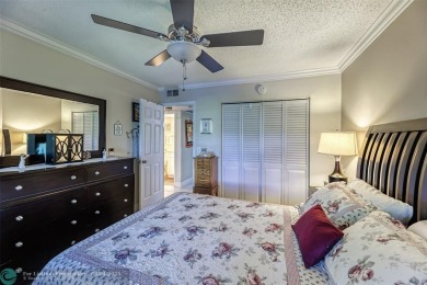 This charming, partially furnished, two bedroom, one and a half on Hillsboro Pines Golf in Florida - for sale on GolfHomes.com, golf home, golf lot