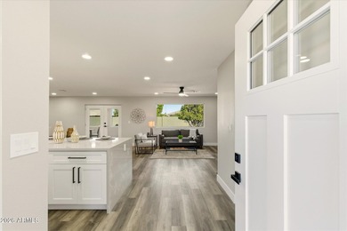 Completely remodeled home with beautiful new LVP flooring on Sunland Village Golf Club in Arizona - for sale on GolfHomes.com, golf home, golf lot