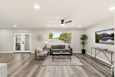 Completely remodeled home with beautiful new LVP flooring on Sunland Village Golf Club in Arizona - for sale on GolfHomes.com, golf home, golf lot