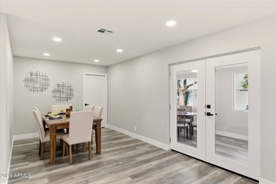 Completely remodeled home with beautiful new LVP flooring on Sunland Village Golf Club in Arizona - for sale on GolfHomes.com, golf home, golf lot