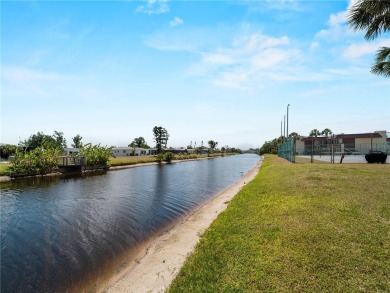 Peaceful water views, two pools, and access to kayak storage on Rotonda Golf and Country Club The Hills Course in Florida - for sale on GolfHomes.com, golf home, golf lot