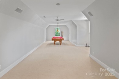 Welcome to 105 Gammon Point Ct - a elegant 4BR home nestled on on Trump National Golf Club Charlotte in North Carolina - for sale on GolfHomes.com, golf home, golf lot