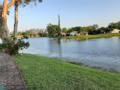 Nestled in a highly desirable International Village, this cozy on Inverrary Country Club in Florida - for sale on GolfHomes.com, golf home, golf lot