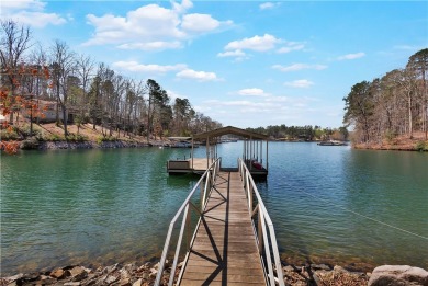 Keowee Key Lakefront Home with Covered Dock in Place boasting on Keowee Key Golf and Country Club in South Carolina - for sale on GolfHomes.com, golf home, golf lot