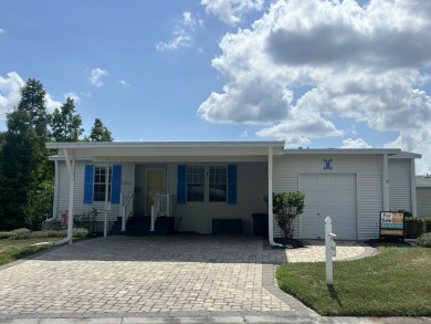 This home is located within a 55+ resort style leased land on Big Cypress Golf and Country Club in Florida - for sale on GolfHomes.com, golf home, golf lot