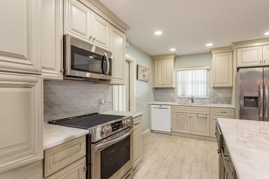 Welcome to your beautifully remodeled villa in the highly on Highland Lakes Executive Golf Course in Florida - for sale on GolfHomes.com, golf home, golf lot