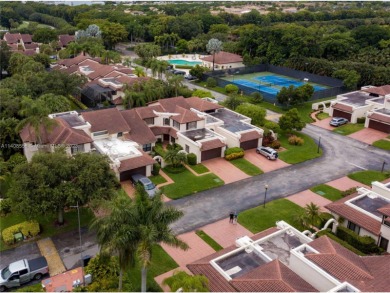 The home is in a gated community inside Doral Estate, surrounded on Doral Golf Resort in Florida - for sale on GolfHomes.com, golf home, golf lot