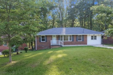 This charming 3-bedroom, 2-bath, 4-sided brick ranch in on Browns Mill Golf Course in Georgia - for sale on GolfHomes.com, golf home, golf lot