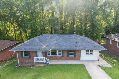 This charming 3-bedroom, 2-bath, 4-sided brick ranch in on Browns Mill Golf Course in Georgia - for sale on GolfHomes.com, golf home, golf lot