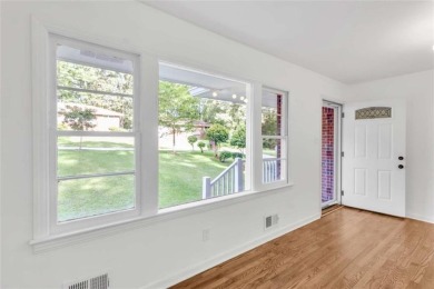 This charming 3-bedroom, 2-bath, 4-sided brick ranch in on Browns Mill Golf Course in Georgia - for sale on GolfHomes.com, golf home, golf lot