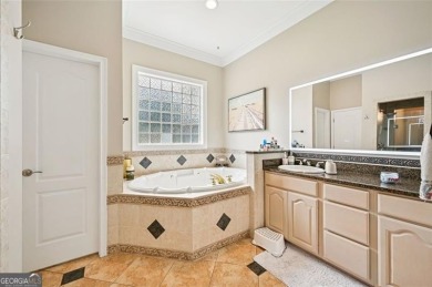 Welcome to this expansive executive-style estate, perfectly on Meadow Lakes Golf Course in Georgia - for sale on GolfHomes.com, golf home, golf lot