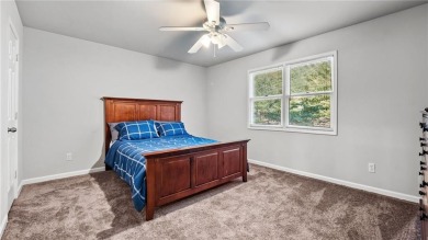 Located in the sought-after Pine Ridge Country Club Estates on Collins Hill Golf Club in Georgia - for sale on GolfHomes.com, golf home, golf lot