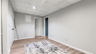 Located in the sought-after Pine Ridge Country Club Estates on Collins Hill Golf Club in Georgia - for sale on GolfHomes.com, golf home, golf lot