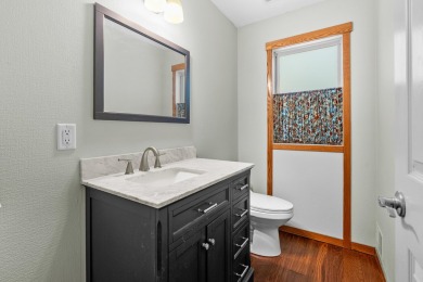 Tucked away on a large, private, wooded lot, this beautifully on Ridgeview Golf Course in Michigan - for sale on GolfHomes.com, golf home, golf lot