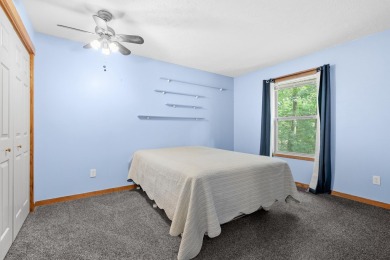 Tucked away on a large, private, wooded lot, this beautifully on Ridgeview Golf Course in Michigan - for sale on GolfHomes.com, golf home, golf lot