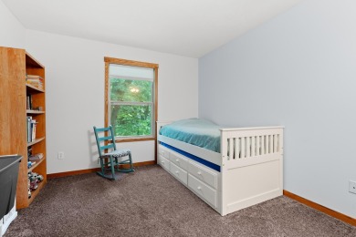 Tucked away on a large, private, wooded lot, this beautifully on Ridgeview Golf Course in Michigan - for sale on GolfHomes.com, golf home, golf lot