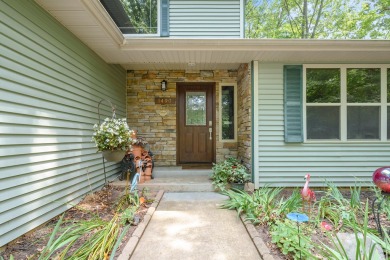 Tucked away on a large, private, wooded lot, this beautifully on Ridgeview Golf Course in Michigan - for sale on GolfHomes.com, golf home, golf lot