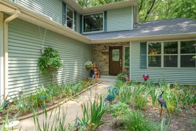 Tucked away on a large, private, wooded lot, this beautifully on Ridgeview Golf Course in Michigan - for sale on GolfHomes.com, golf home, golf lot