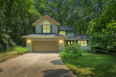 Tucked away on a large, private, wooded lot, this beautifully on Ridgeview Golf Course in Michigan - for sale on GolfHomes.com, golf home, golf lot