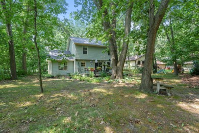 Tucked away on a large, private, wooded lot, this beautifully on Ridgeview Golf Course in Michigan - for sale on GolfHomes.com, golf home, golf lot