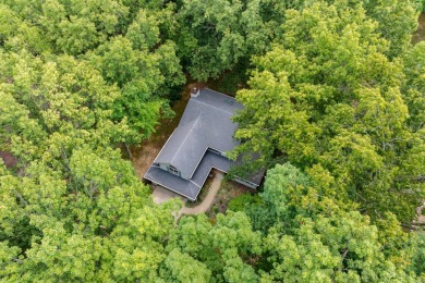 Tucked away on a large, private, wooded lot, this beautifully on Ridgeview Golf Course in Michigan - for sale on GolfHomes.com, golf home, golf lot
