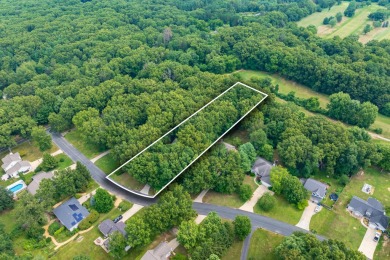 Tucked away on a large, private, wooded lot, this beautifully on Ridgeview Golf Course in Michigan - for sale on GolfHomes.com, golf home, golf lot