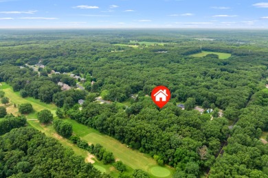 Tucked away on a large, private, wooded lot, this beautifully on Ridgeview Golf Course in Michigan - for sale on GolfHomes.com, golf home, golf lot