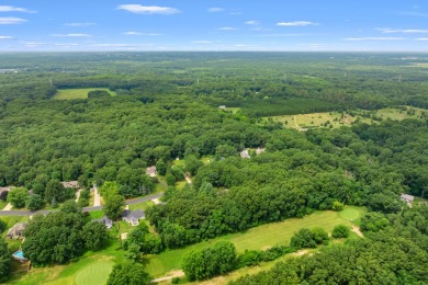 Tucked away on a large, private, wooded lot, this beautifully on Ridgeview Golf Course in Michigan - for sale on GolfHomes.com, golf home, golf lot