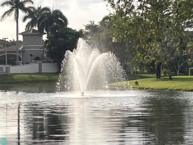 Beautiful water view 2/2 condo is presented to you with enclosed on Wynmoor Golf Course in Florida - for sale on GolfHomes.com, golf home, golf lot