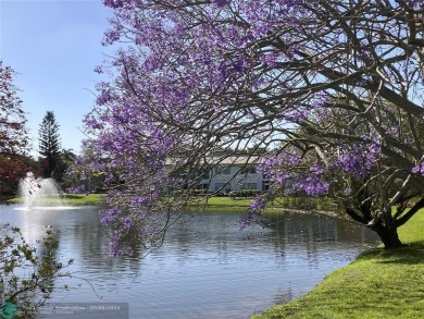 Beautiful water view 2/2 condo is presented to you with enclosed on Wynmoor Golf Course in Florida - for sale on GolfHomes.com, golf home, golf lot