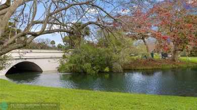 Beautiful water view 2/2 condo is presented to you with enclosed on Wynmoor Golf Course in Florida - for sale on GolfHomes.com, golf home, golf lot