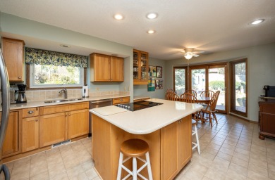 Set on a beautifully landscaped half-acre lot, this spacious on Urbandale Golf and Country Club in Iowa - for sale on GolfHomes.com, golf home, golf lot