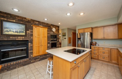 Set on a beautifully landscaped half-acre lot, this spacious on Urbandale Golf and Country Club in Iowa - for sale on GolfHomes.com, golf home, golf lot