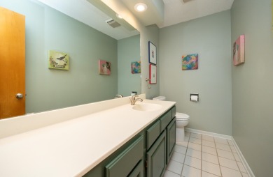 Set on a beautifully landscaped half-acre lot, this spacious on Urbandale Golf and Country Club in Iowa - for sale on GolfHomes.com, golf home, golf lot